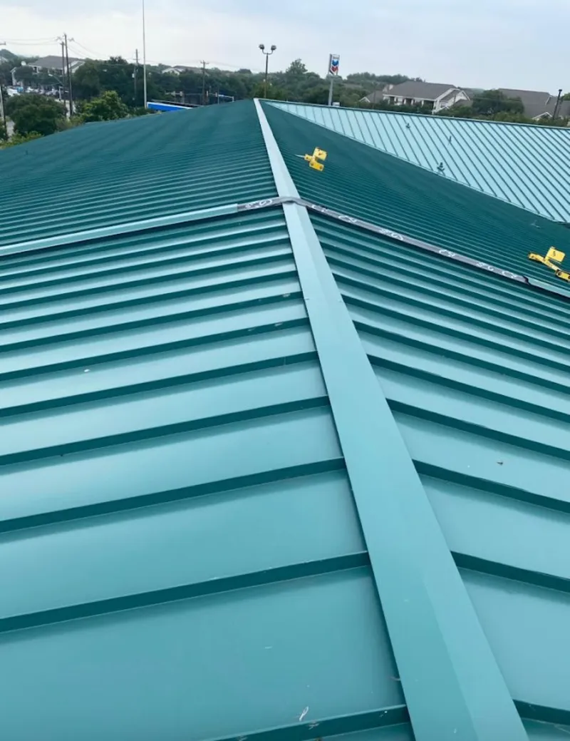 Green commercial metal roof ridge and valley for Metal Roof Repair in Gunnison
